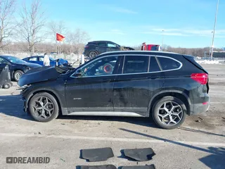 2017 BMW X1 xDrive28i with VIN WBXHT3C37H5F82992, listed as a IAAI auction lot 41293740 with 161,418 mi miles. Bid and sale history available at carsss.com. Image 14.