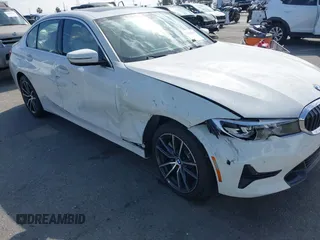 2019 BMW 3 Series 330i with VIN WBA5R1C55KAK12332, listed as a IAAI auction lot 41692035 with 13,657 mi miles and . Bid and sale history available at DreamBid. Image 6.