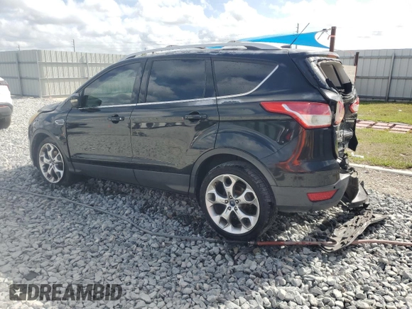 2014 Ford Escape Titanium with VIN 1FMCU0JX7EUA66831, listed as a Copart auction lot 51574815 with 204,150 mi miles and Salvage Title. Bid and sale history available at carsss.com. Image 2.