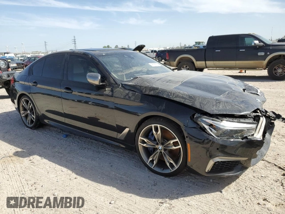 2020 BMW 5 Series M550i xDrive z VIN WBAJS7C01LCD23365, wystawiony jako Copart lot #49166705 z przebiegiem 42 293 mil mil oraz Szkoda całkowita • Salvage title. Historia ofert i sprzedaży dostępna na DreamBid. Obrazek 4.