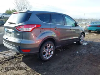 2013 Ford Escape SEL with VIN 1FMCU9H92DUA24934, listed as a IAAI auction lot 41832566 with 124,705 mi miles. Bid and sale history available at carsss.com. Image 4.