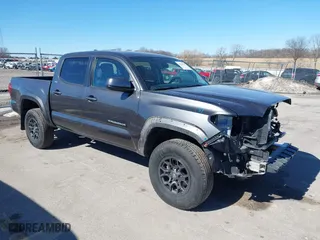 2019 Toyota Tacoma 4WD SR with VIN 3TMCZ5AN9KM275537, listed as a IAAI auction lot 41694037 with 102,933 mi miles. Bid and sale history available at carsss.com. Image 1.