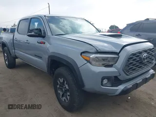 2021 Toyota Tacoma SR5 z VIN 5TFDZ5BN3MX067332, wystawiony jako IAAI lot #42509918 z przebiegiem 15 255 mil mil oraz . Historia ofert i sprzedaży dostępna na DreamBid. Obrazek 1.