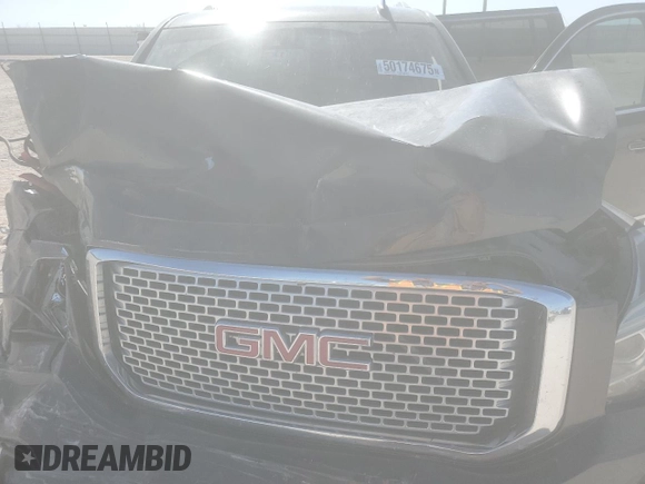 2015 GMC Yukon XL Denali with VIN 1GKS2JKJ3FR743050, listed as a Copart auction lot 50174675 with 143,154 mi miles and Salvage Title. Bid and sale history available at carsss.com. Image 12.