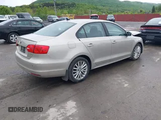 2014 Volkswagen Jetta TDI w/Premium/Nav with VIN 3VWLL7AJ9EM226026, listed as a IAAI auction lot 42219871 with 100,386 mi miles and . Bid and sale history available at DreamBid. Image 4.