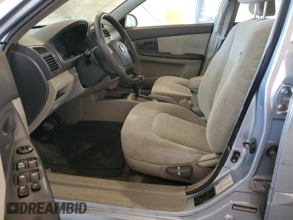 2005 Kia Spectra LX with VIN KNAFE121955160165, listed as a Copart auction lot 74695764 with 160,670 mi miles and Salvage Title. Bid and sale history available at carsss.com. Image 7.