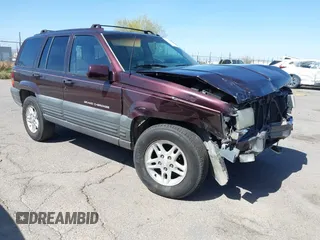 1996 Jeep Grand Cherokee Laredo with VIN 1J4GZ58S3TC391942, listed as a IAAI auction lot 41711778 with 202,765 mi miles. Bid and sale history available at carsss.com. Image 1.