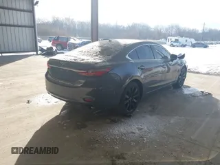 2021 Mazda 6 Carbon Edition with VIN JM1GL1WY6M1616617, listed as a IAAI auction lot 41365615 with 60,747 mi miles and . Bid and sale history available at DreamBid. Image 4.