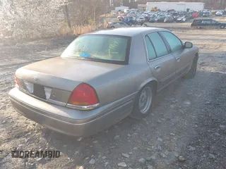 2002 Ford Crown Victoria LX z VIN 2FAFP74W32X159473, wystawiony jako IAAI lot #41759610 z przebiegiem 86 523 mil mil oraz . Historia ofert i sprzedaży dostępna na DreamBid. Obrazek 4.