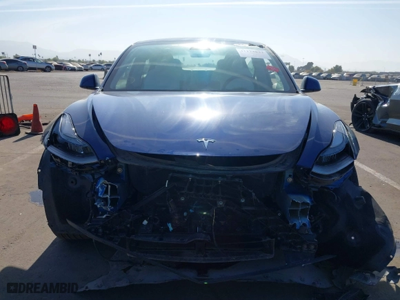 2023 Tesla Model 3 with VIN 5YJ3E1EA9PF697573, listed as a IAAI auction lot 41173833 with 6,966 mi miles. Bid and sale history available at carsss.com. Image 12.