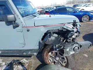 2015 Jeep Wrangler Unlimited Willys Wheeler with VIN 1C4BJWDG4FL589822, listed as a IAAI auction lot 41732614 with 149,112 mi miles and . Bid and sale history available at DreamBid. Image 18.