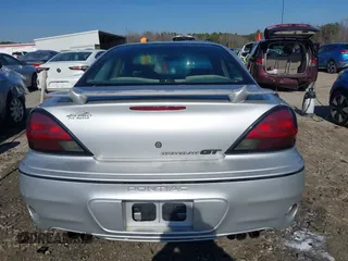 2003 Pontiac Grand Am GT with VIN 1G2NW52E13M612218, listed as a IAAI auction lot 41478495 with 242,179 mi miles. Bid and sale history available at carsss.com. Image 17.