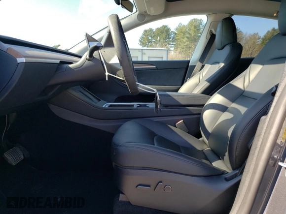 2023 Tesla Model Y Long Range with VIN 7SAYGDEE8PF889879, listed as a Copart auction lot 46115535 with 17,818 mi miles and Salvage Title. Bid and sale history available at DreamBid. Image 7.