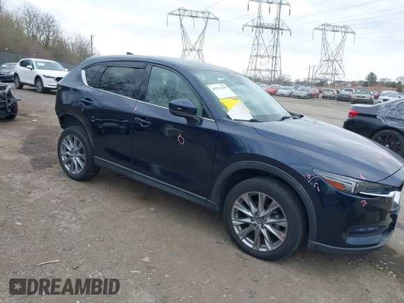 2021 Mazda CX-5 Grand Touring with VIN JM3KFADM0M1321375, listed as a IAAI auction lot 41913449 with 88,178 mi miles. Bid and sale history available at carsss.com. Image 1.