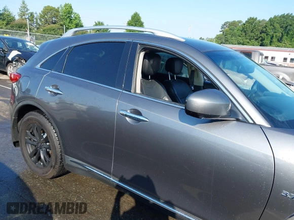 2017 Infiniti QX70 z VIN JN8CS1MW4HM410322, wystawiony jako IAAI lot #42285313 z przebiegiem 126 031 mil mil oraz . Historia ofert i sprzedaży dostępna na DreamBid. Obrazek 13.