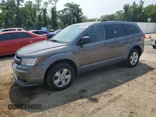 2013 Dodge Journey SE with VIN 3C4PDCAB5DT666607, listed as a Copart auction lot 59140655 with 146,067 mi miles and Salvage title. Bid and sale history available at DreamBid. Image 1.