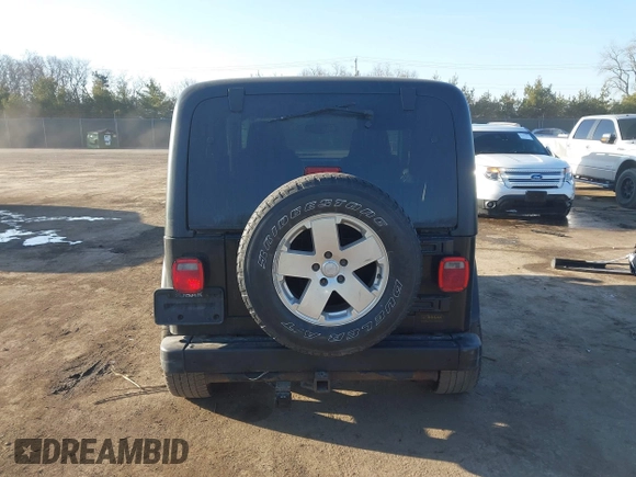 2006 Jeep Wrangler Sport with VIN 1J4FA49SX6P733671, listed as a IAAI auction lot 41779611 with 189,701 mi miles and . Bid and sale history available at carsss.com. Image 16.