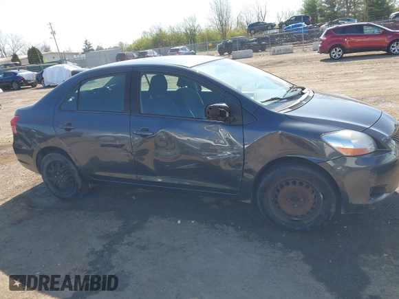 2009 Toyota Yaris with VIN JTDBT903194047784, listed as a IAAI auction lot 42049872 with 115,735 mi miles. Bid and sale history available at carsss.com. Image 13.