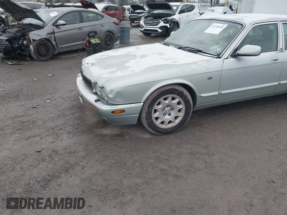 1998 Jaguar XJ with VIN SAJHN1242WC819689, listed as a IAAI auction lot 41148530 with 60,143 mi miles and . Bid and sale history available at DreamBid. Image 6.