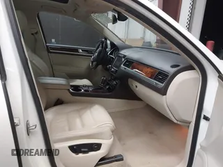 2012 Volkswagen Touareg Sport with VIN WVGFK9BP2CD002991, listed as a IAAI auction lot 42077523 with 94,515 mi miles and . Bid and sale history available at DreamBid. Image 5.