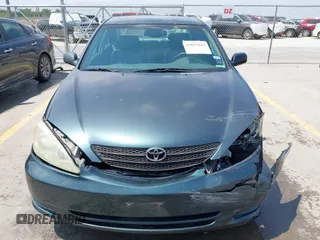 2002 Toyota Camry LE z VIN 4T1BE30KX2U591037, wystawiony jako IAAI lot #42077641 z przebiegiem 86 569 mil mil oraz . Historia ofert i sprzedaży dostępna na DreamBid. Obrazek 12.
