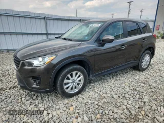 2016 Mazda CX-5 Touring z VIN JM3KE4CY8G0635312, wystawiony jako Copart lot #59614535 z przebiegiem 138 768 mil mil oraz Czysty tytuł • Clean title. Historia ofert i sprzedaży dostępna na DreamBid. Obrazek 1.