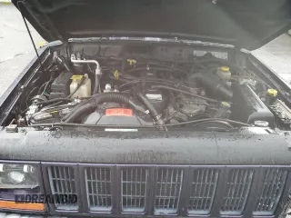 1999 Jeep Cherokee Sport with VIN 1J4FF68S6XL602177, listed as a Copart auction lot 51962355 with 176,386 mi miles and Salvage Title. Bid and sale history available at carsss.com. Image 12.
