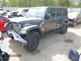 2019 Jeep Wrangler Unlimited Sport S with VIN 1C4HJXDG2KW516571, listed as a IAAI auction lot 42043223 with 58,131 mi miles and . Bid and sale history available at DreamBid. Image 17.