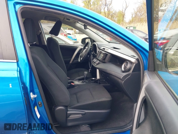 2018 Toyota RAV4 LE with VIN JTMBFREV8JJ220630, listed as a IAAI auction lot 42001795 with 86,027 mi miles. Bid and sale history available at carsss.com. Image 5.