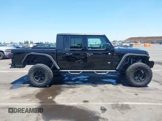 2020 Jeep Gladiator Sport S with VIN 1C6HJTAGXLL123540, listed as a IAAI auction lot 42453999 with 27,855 mi miles and . Bid and sale history available at DreamBid. Image 14.