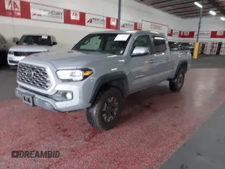 2021 Toyota Tacoma SR5 z VIN 3TMDZ5BN5MM114494, wystawiony jako IAAI lot #41723032 z przebiegiem 54 477 mil mil oraz . Historia ofert i sprzedaży dostępna na DreamBid. Obrazek 2.