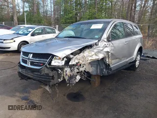 2015 Dodge Journey SE z VIN 3C4PDCAB3FT641675, wystawiony jako IAAI lot #41898611 z przebiegiem 218 121 mil mil oraz . Historia ofert i sprzedaży dostępna na DreamBid. Obrazek 2.
