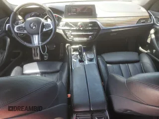 2018 BMW 5 Series 540i with VIN WBAJE5C58JWA96615, listed as a Copart auction lot 56117205 with 87,211 mi miles and Salvage title. Bid and sale history available at DreamBid. Image 8.
