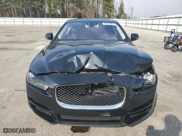 2017 Jaguar XE 25t with VIN SAJAR4BGXHA965404, listed as a Copart auction lot 49105855 with 76,990 mi miles and Salvage Title. Bid and sale history available at carsss.com. Image 5.