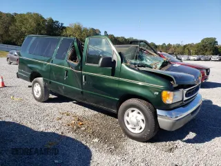 1999 Ford Econoline Passenger XL with VIN 1FBSS31L0XHB12679, listed as a Copart auction lot 74257504 with 136,821 mi miles and Salvage Title. Bid and sale history available at DreamBid. Image 4.