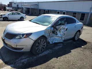 2014 Lincoln MKS EcoBoost z VIN 1LNHL9FT6EG606882, wystawiony jako Copart lot #52577885 z przebiegiem 125 864 mil mil oraz Nie do naprawy • Non repairable. Historia ofert i sprzedaży dostępna na DreamBid. Obrazek 1.
