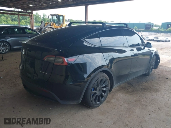 2023 Tesla Model Y Long Range with VIN 7SAYGDEE3PA185778, listed as a IAAI auction lot 39721611 with 11,986 mi miles and . Bid and sale history available at DreamBid. Image 4.