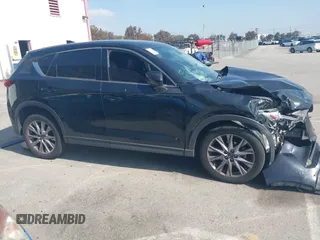 2019 Mazda CX-5 Grand Touring with VIN JM3KFADMXK1547727, listed as a IAAI auction lot 42138071 with Not provided miles and . Bid and sale history available at DreamBid. Image 13.