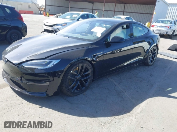 2022 Tesla Model S Plaid with VIN 5YJSA1E62NF460634, listed as a IAAI auction lot 41372644 with 16,050 mi miles and . Bid and sale history available at DreamBid. Image 17.