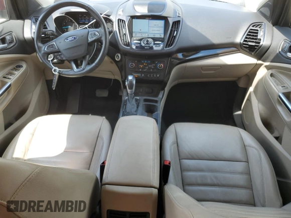 2019 Ford Escape Titanium z VIN 1FMCU0J97KUB20612, wystawiony jako Copart lot #64638415 z przebiegiem 100 102 mil mil oraz Czysty tytuł • Clean title. Historia ofert i sprzedaży dostępna na DreamBid. Obrazek 8.