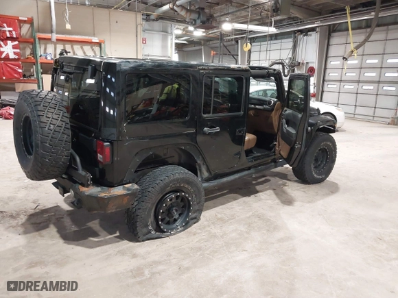 2011 Jeep Wrangler Unlimited Sahara with VIN 1J4HA5H12BL557059, listed as a IAAI auction lot 41856882 with 150,683 mi miles. Bid and sale history available at carsss.com. Image 4.