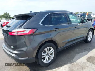 2020 Ford Edge SEL z VIN 2FMPK3J9XLBA54556, wystawiony jako IAAI lot #42179907 z przebiegiem 63 449 mil mil oraz . Historia ofert i sprzedaży dostępna na DreamBid. Obrazek 4.
