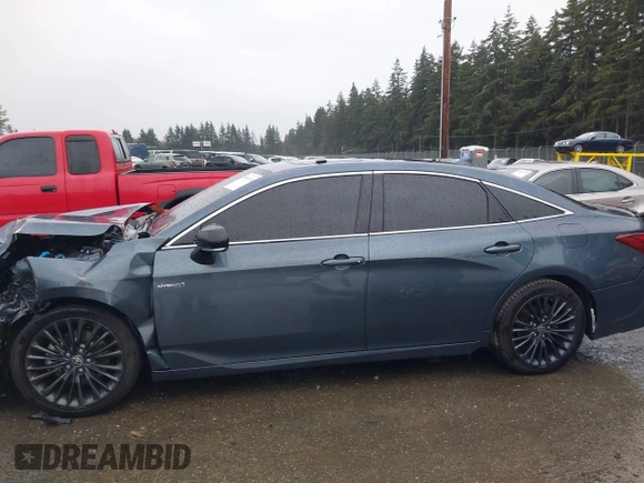 2021 Toyota Avalon Hybrid XSE z VIN 4T1EA1AB9MU007905, wystawiony jako IAAI lot #40501204 z przebiegiem 86 869 mil mil oraz . Historia ofert i sprzedaży dostępna na DreamBid. Obrazek 14.