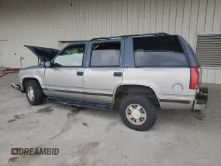 1999 GMC Yukon with VIN 1GKEC13R4XJ735246, listed as a Copart auction lot 56429874 with 258,616 mi miles and Salvage Title. Bid and sale history available at carsss.com. Image 2.