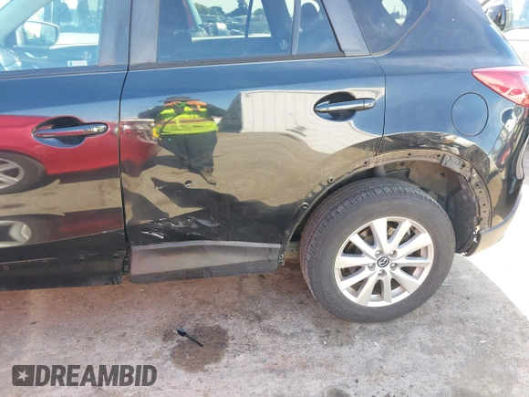 2016 Mazda CX-5 Touring z VIN JM3KE4CY2G0656270, wystawiony jako IAAI lot #42344489 z przebiegiem 60 449 mil mil oraz . Historia ofert i sprzedaży dostępna na DreamBid. Obrazek 18.