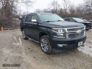 2016 Chevrolet Tahoe LTZ with VIN 1GNSKCKC2GR104305, listed as a IAAI auction lot 41697868 with 124,670 mi miles. Bid and sale history available at carsss.com. Image 1.