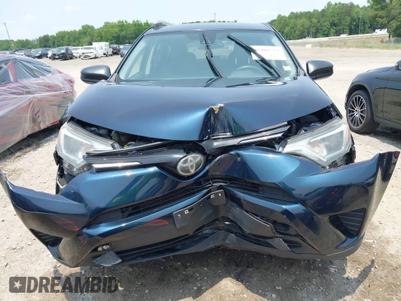 2017 Toyota RAV4 LE with VIN JTMBFREV5HJ173180, listed as a IAAI auction lot 42402753 with 97,917 mi miles and . Bid and sale history available at DreamBid. Image 6.