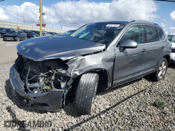 2014 Volkswagen Touareg Lux z VIN WVGEF9BP1ED007974, wystawiony jako Copart lot #82627834 z przebiegiem Nie podano mil oraz Szkoda całkowita • Salvage title. Historia ofert i sprzedaży dostępna na DreamBid. Obrazek 1.