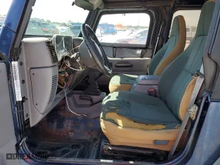 1997 Jeep Wrangler SE with VIN 1J4FY29P2VP446786, listed as a Copart auction lot 52295305 with 0 mi miles and Salvage Title. Bid and sale history available at carsss.com. Image 7.