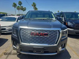 2021 GMC Yukon Denali with VIN 1GKS2DKLXMR125059, listed as a IAAI auction lot 42132398 with 72,384 mi miles. Bid and sale history available at carsss.com. Image 1.